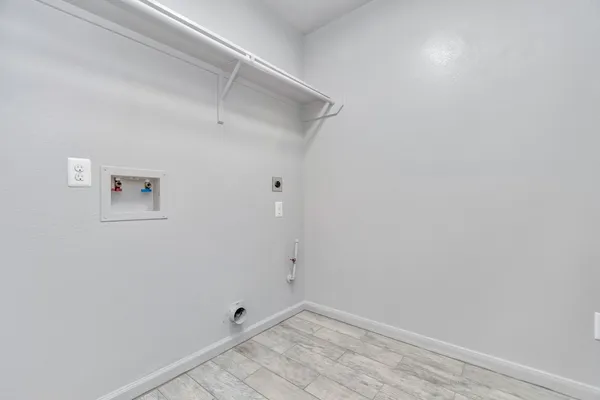 a front view of a house with a yard and fence