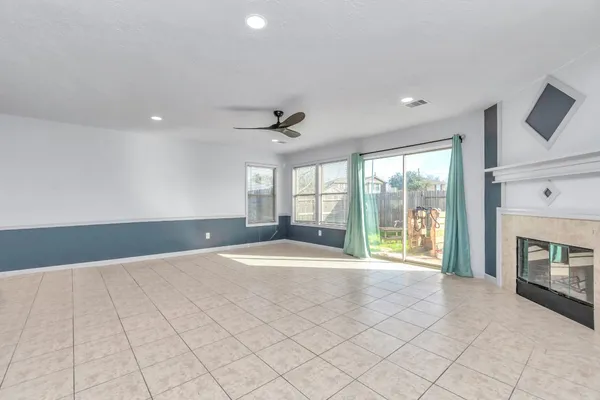 a view of a kitchen with a sink and a fireplace