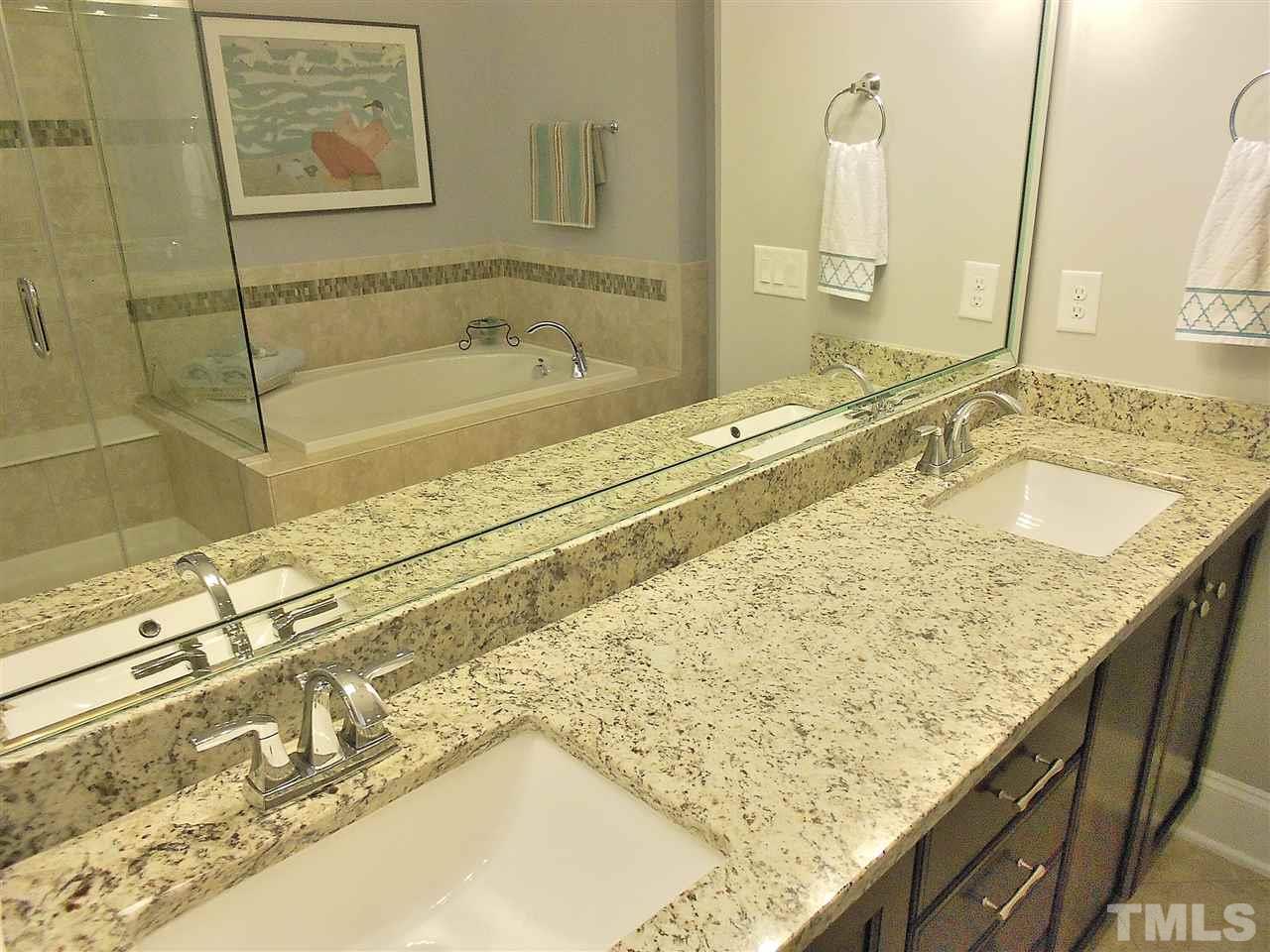 776 Fallon Grove Way Raleigh, NC 27608 - Photo 9 of 22 ...has double sinks in granite top, garden tub, and frameless glass shower