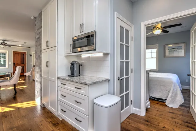 a kitchen with a sink appliances and cabinets