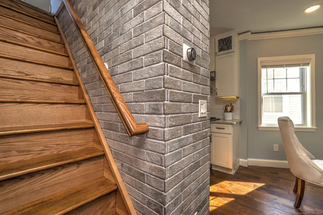 a view of entryway with wooden floor