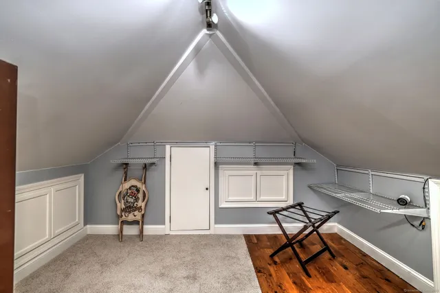 a view of a livingroom with furniture and a window
