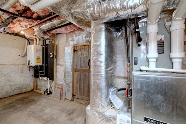 a roof deck with a table and chairs