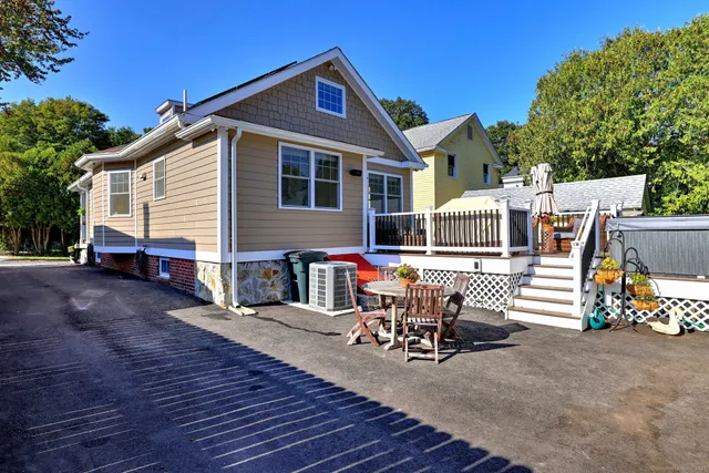 a view of a patio with couches chairs and potted plants