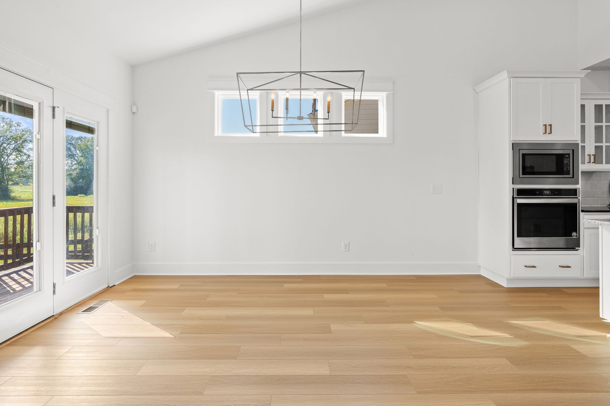 1257 Cotillion Drive Murfreesboro, TN 37128 - Photo 11 of 34 a view of an empty room with a window and kitchen view