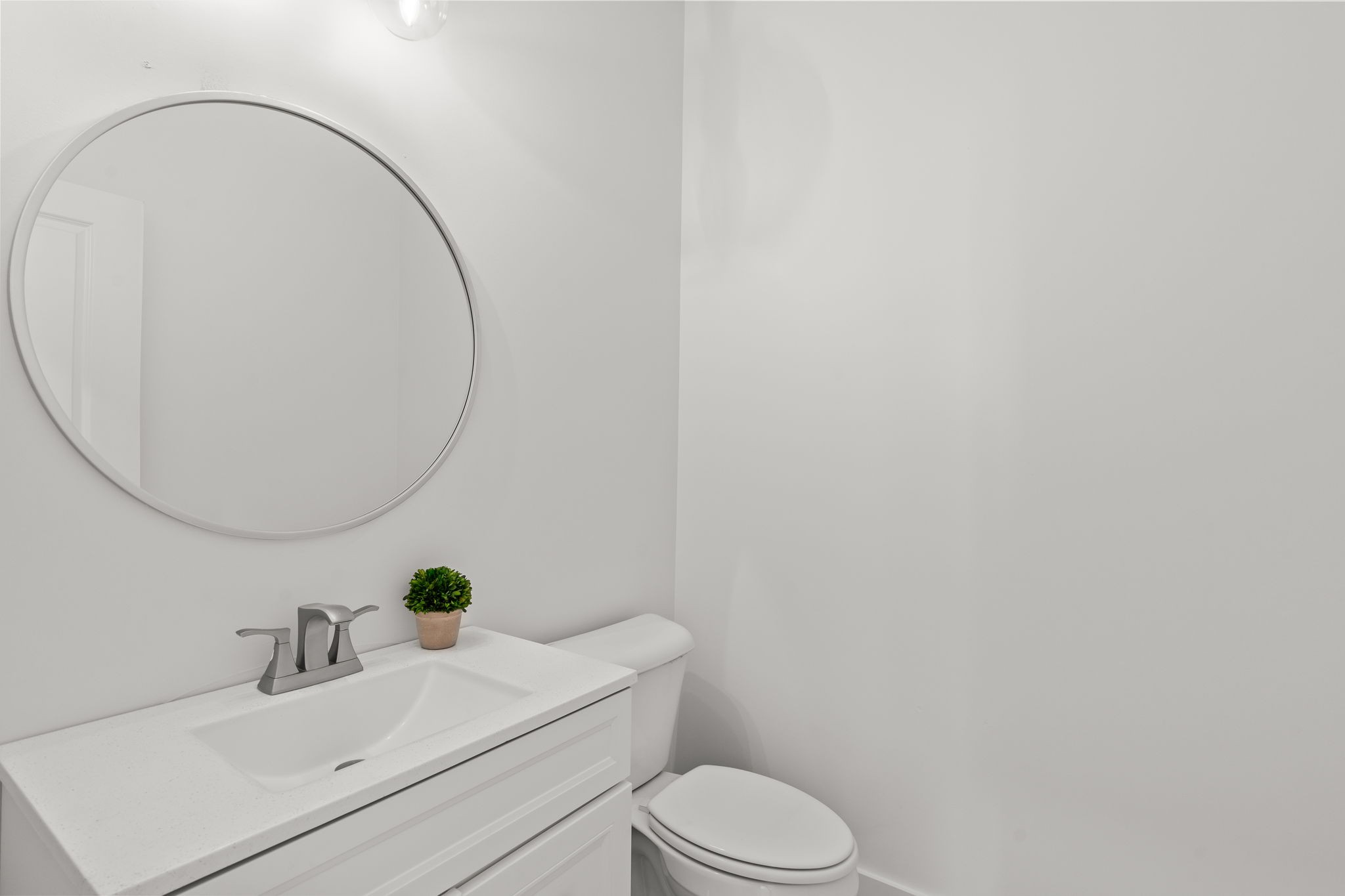 1257 Cotillion Drive Murfreesboro, TN 37128 - Photo 12 of 34 a white toilet sitting next to a bathroom sink