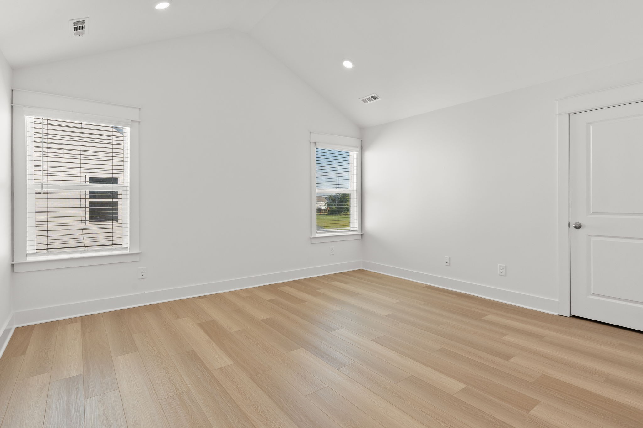 1257 Cotillion Drive Murfreesboro, TN 37128 - Photo 20 of 34 a view of an empty room with wooden floor and a window