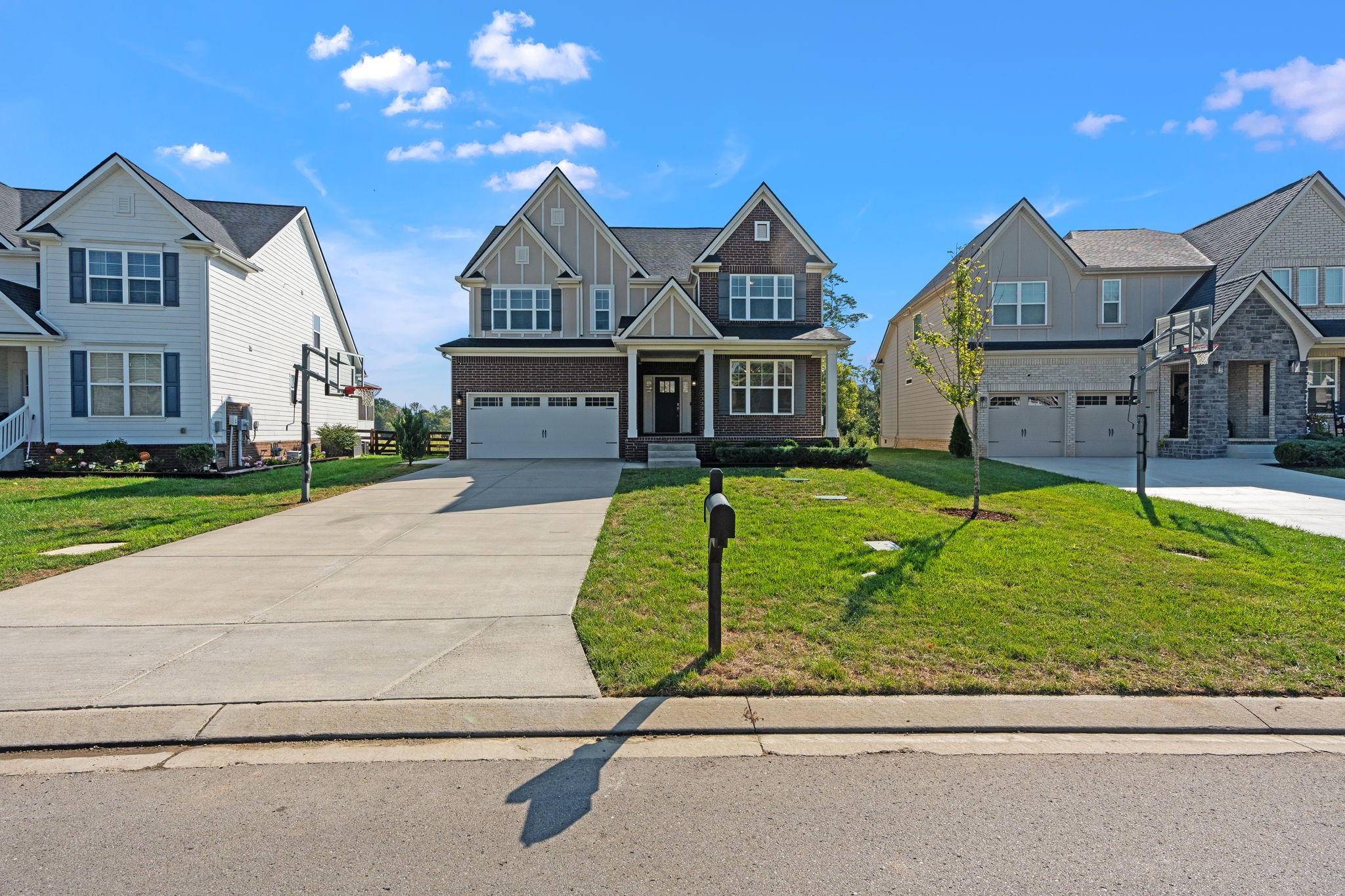 1257 Cotillion Drive Murfreesboro, TN 37128 - Photo 2 of 34 a front view of a house with garden
