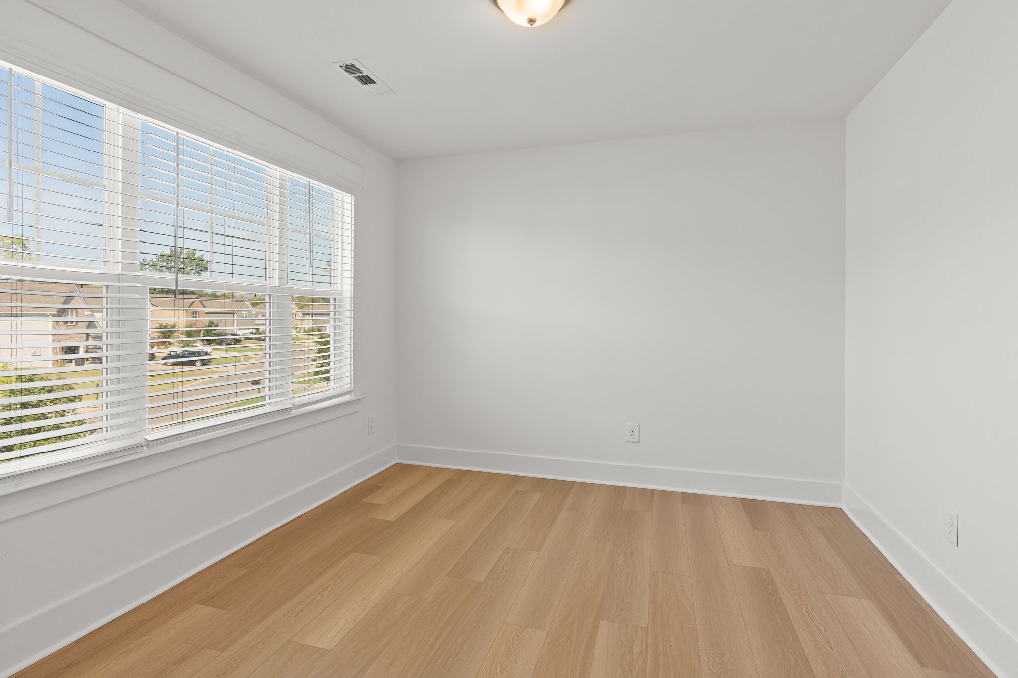 1257 Cotillion Drive Murfreesboro, TN 37128 - Photo 21 of 34 wooden floor in an empty room with a window