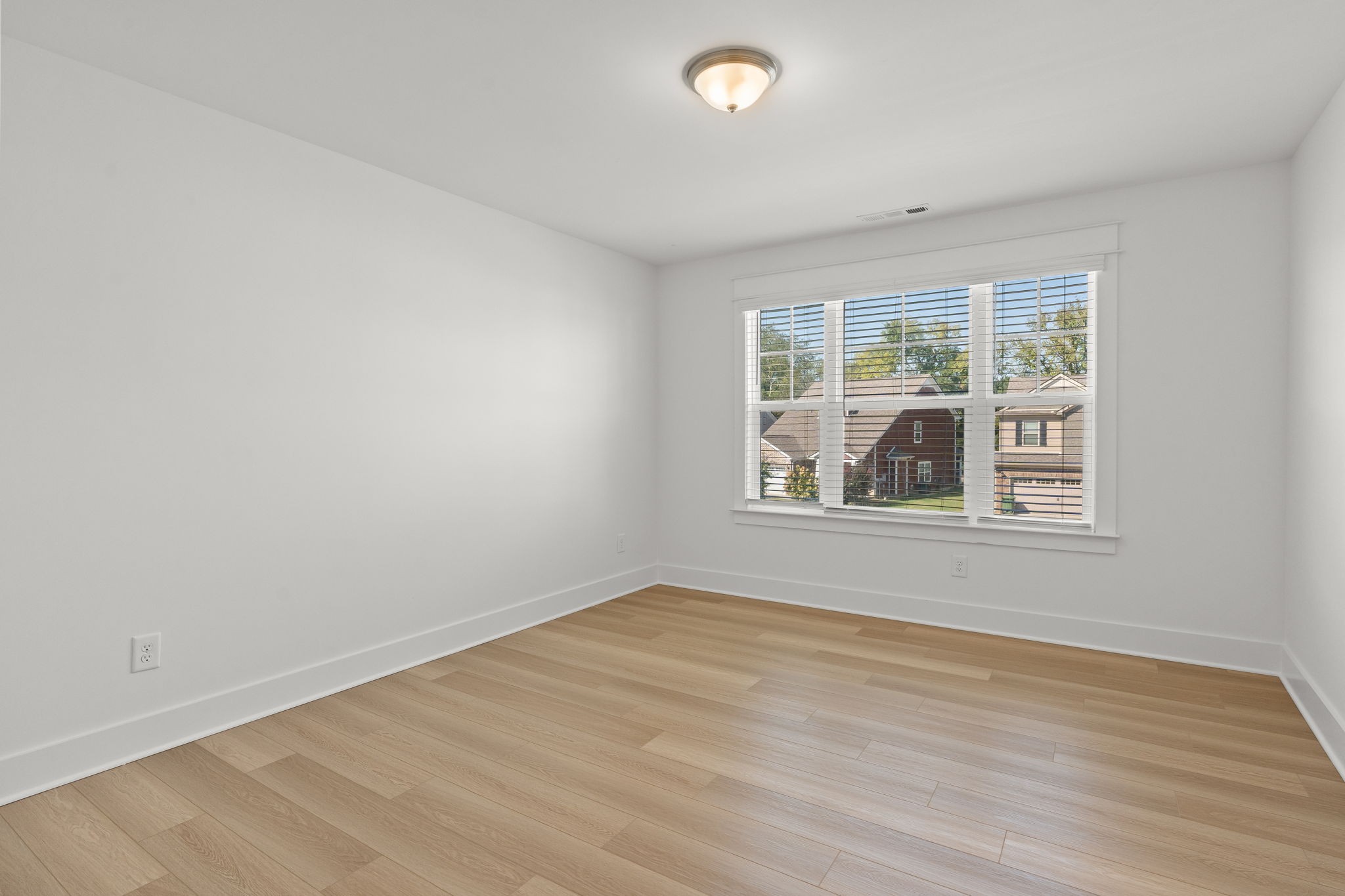 1257 Cotillion Drive Murfreesboro, TN 37128 - Photo 23 of 34 an empty room with wooden floor and windows