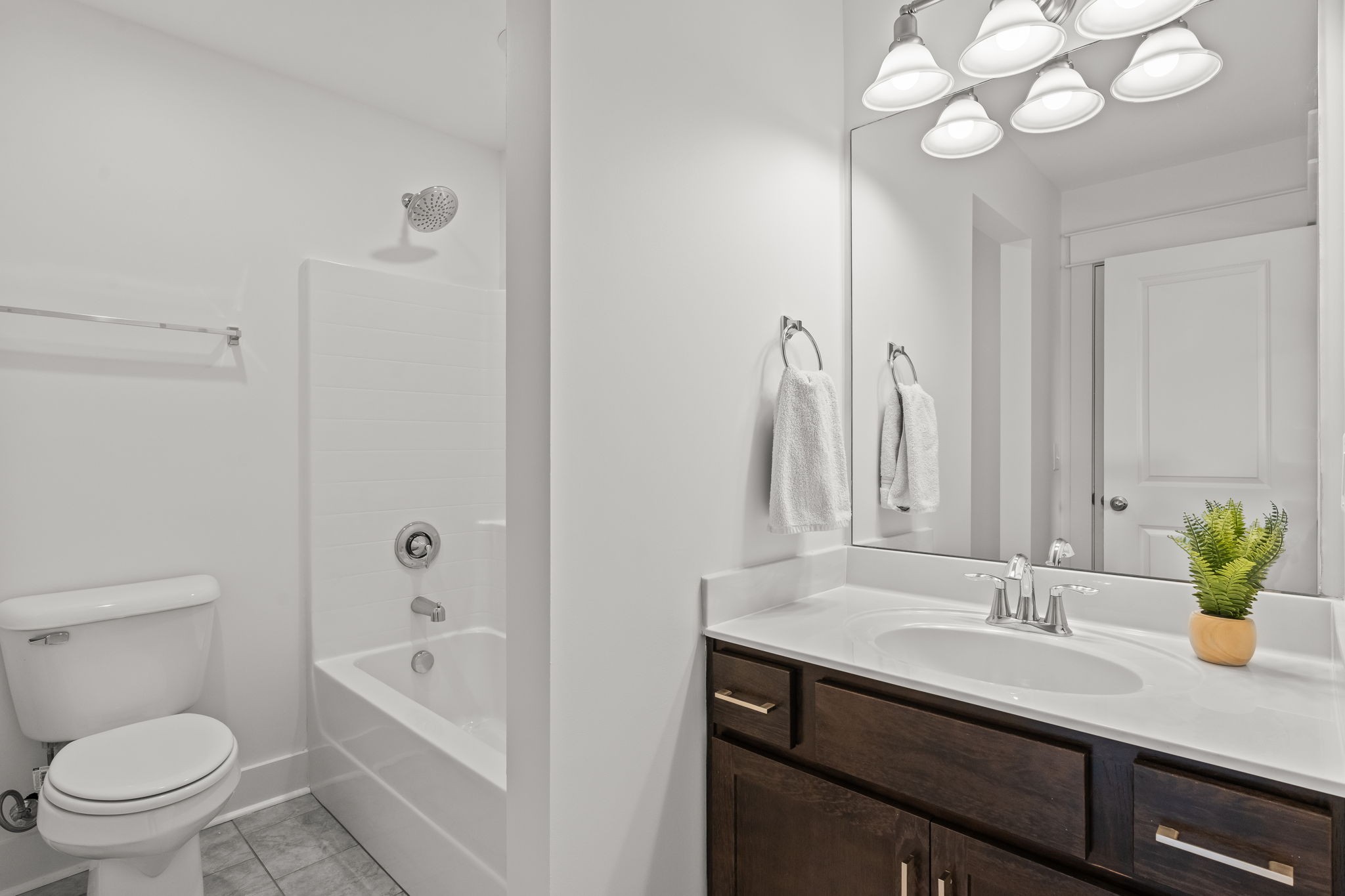 1257 Cotillion Drive Murfreesboro, TN 37128 - Photo 25 of 34 a bathroom with a sink a toilet and a large mirror