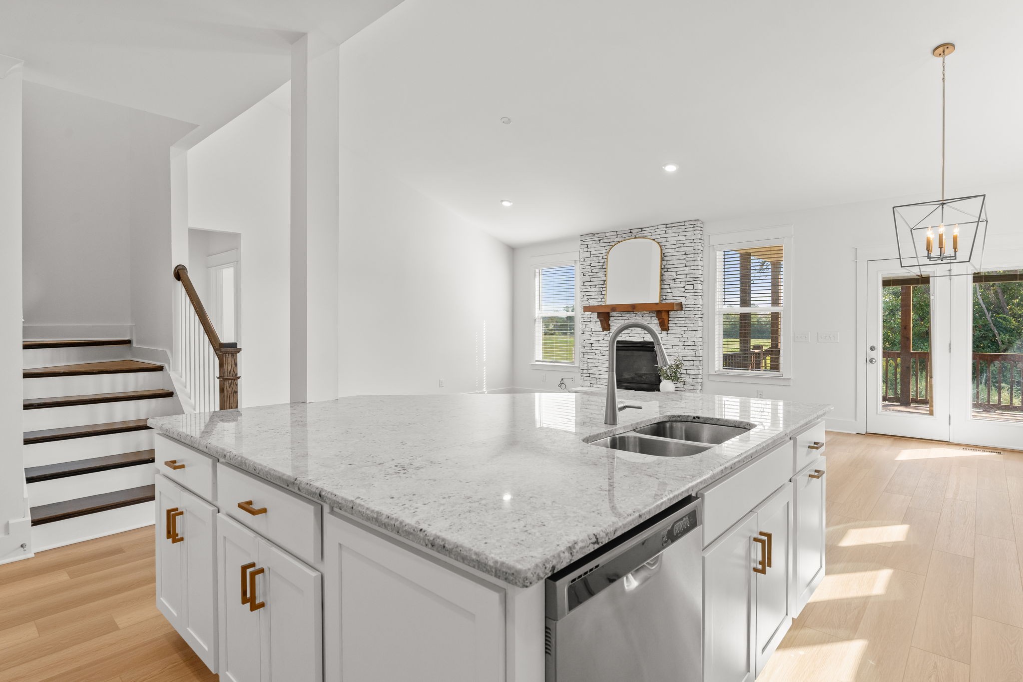 1257 Cotillion Drive Murfreesboro, TN 37128 - Photo 9 of 34 a kitchen with stainless steel appliances granite countertop a sink and a refrigerator
