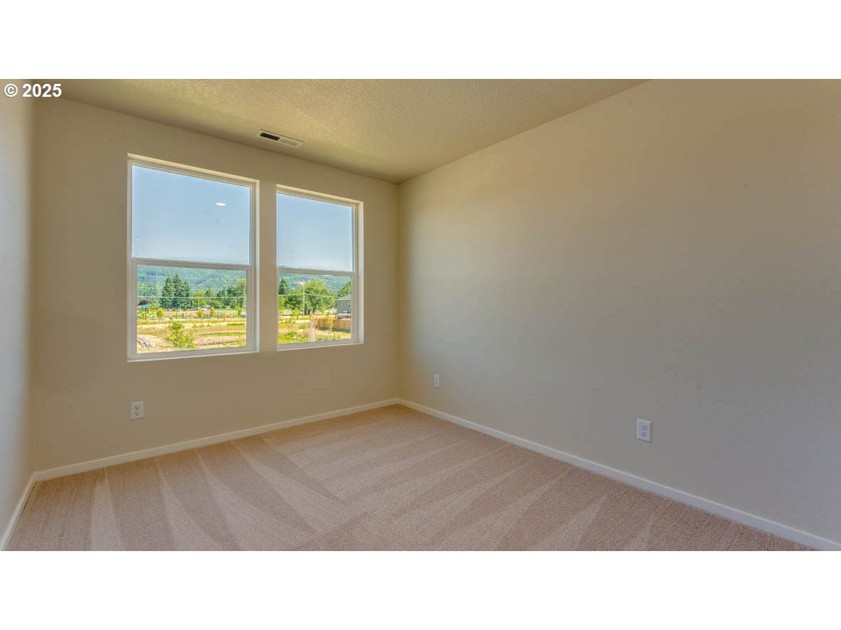 2960 U Street Springfield, OR 97477 - Photo 20 of 24 a open hall with a bench