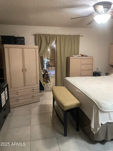 a view of walk in closet with clothes