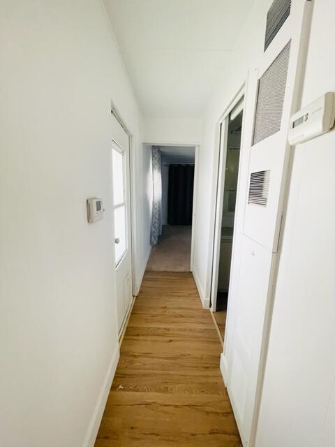 80870 Highway 111 Indio, CA 92201 - Photo 11 of 16 a view of a hallway with wooden floor