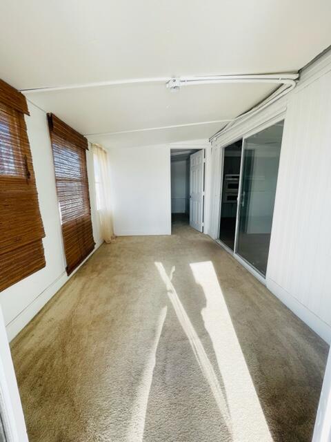 80870 Highway 111 Indio, CA 92201 - Photo 6 of 16 a view of an empty room with wooden floor and a window