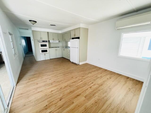 80870 Highway 111 Indio, CA 92201 - Photo 8 of 16 a view of kitchen with refrigerator and window