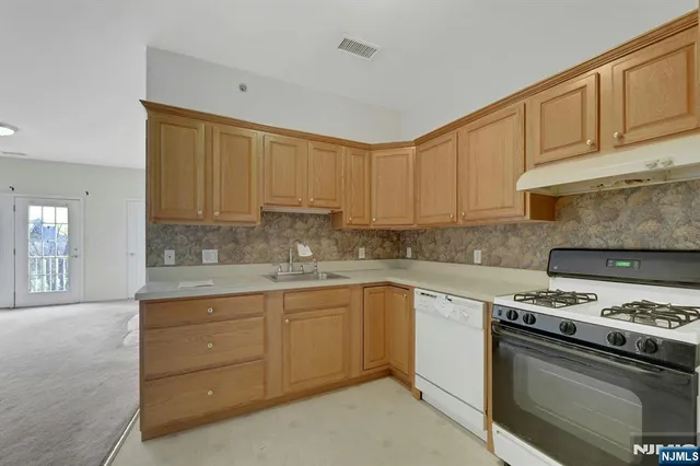 a view of storage and utility room with washer and dryer