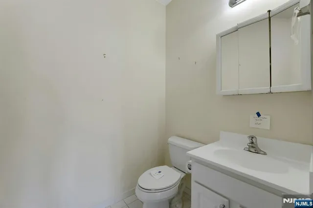 a bathroom with a white toilet