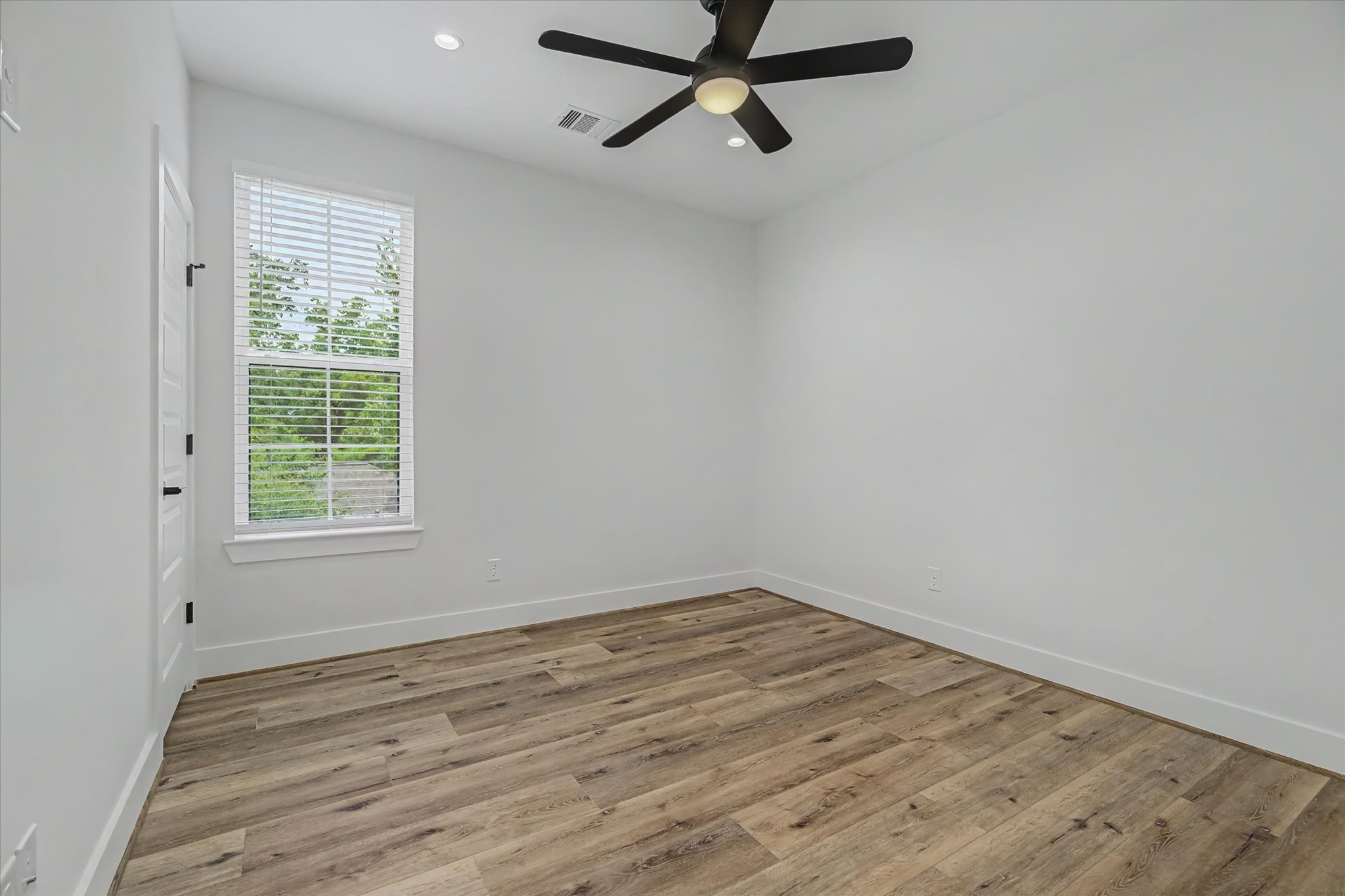 3806 Dreyfus Street Houston, TX 77021 - Photo 36 of 48 Spacious bedroom featuring recessed can lighting and a remote-controlled ceiling fan.
