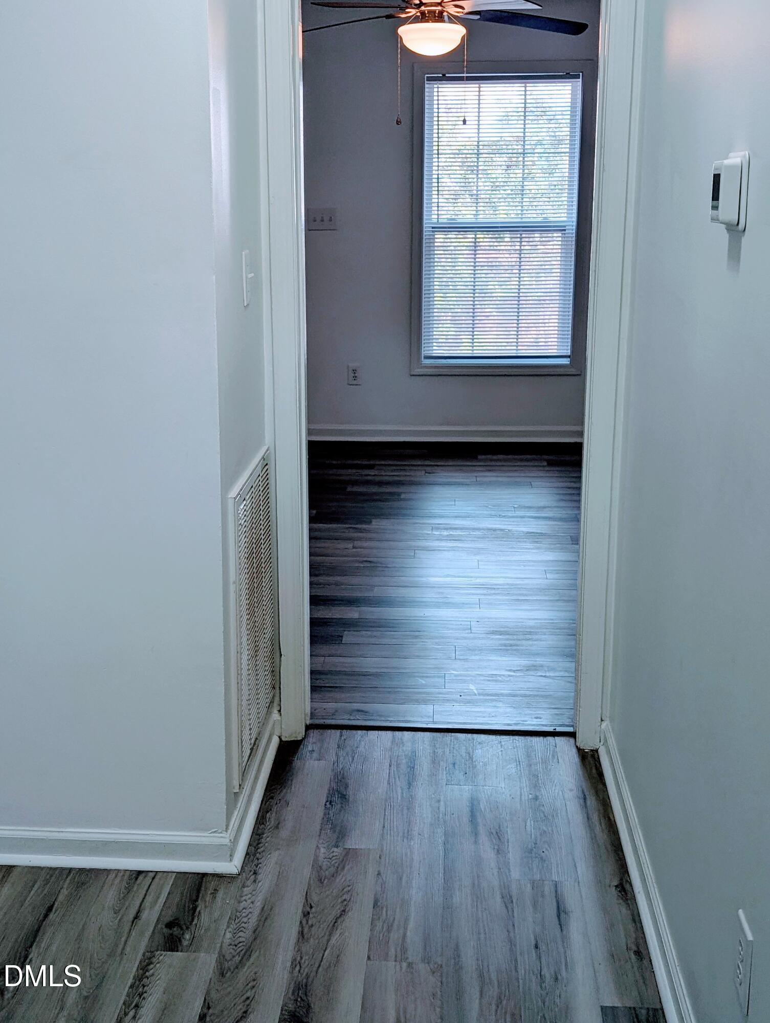 1005 Shades Place Raleigh, NC 27601 - Photo 3 of 18 a view of wooden floor and window in a room