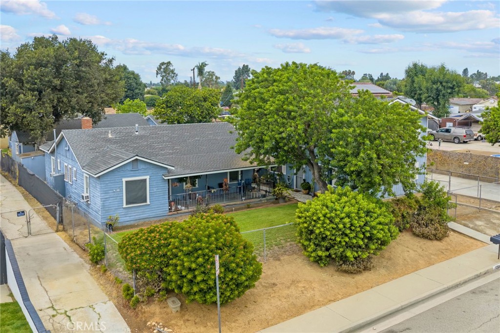 12209-12205 Colima Road Whittier, CA 90604 - Photo 4 of 5 front view of a house with a garden