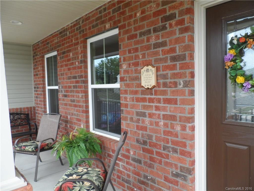 2181 Galloway Lane Southwest Concord, NC 28025 - Photo 3 of 11 a brick building with a potted plant in front of it