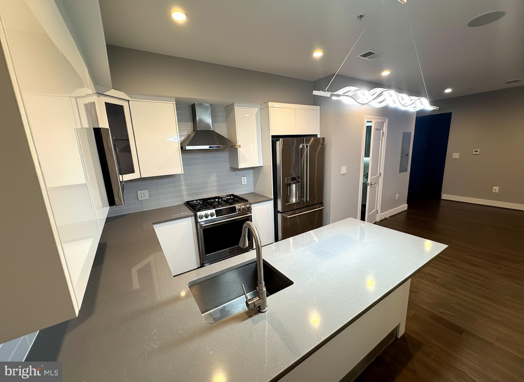 625 Park Road Northwest Washington, DC 20010 - Photo 4 of 22 Sleek modern kitchen with elegant design.