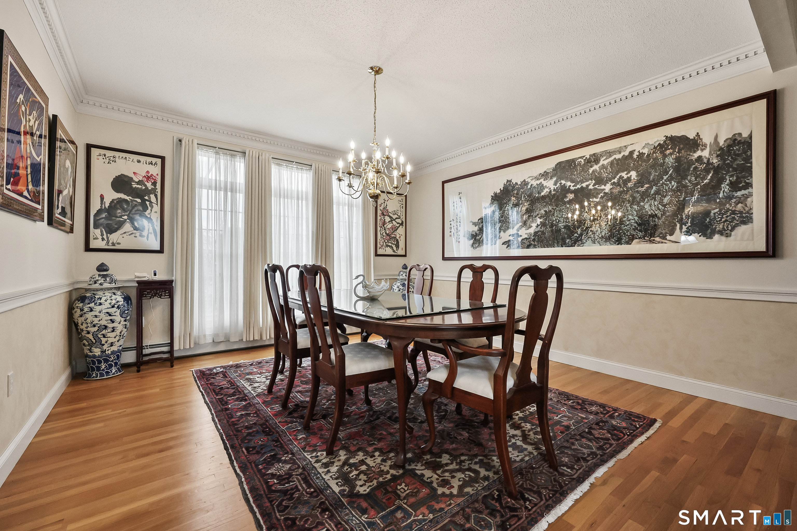 87 Wanda Lane Middletown, CT 06457 - Photo 15 of 39 a view of a dining room with furniture window and wooden floor
