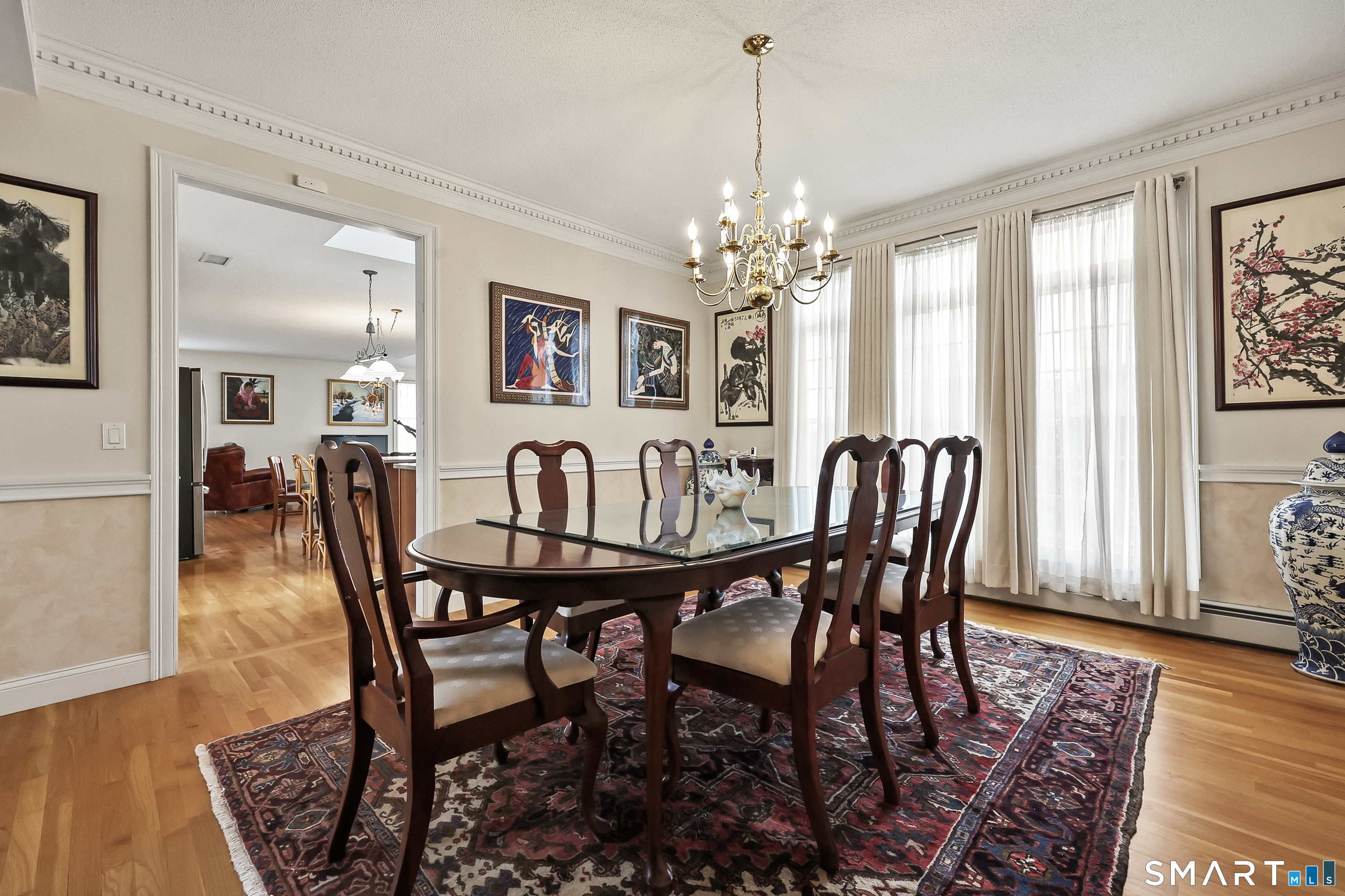 87 Wanda Lane Middletown, CT 06457 - Photo 16 of 39 a view of a dining room with furniture window and wooden floor