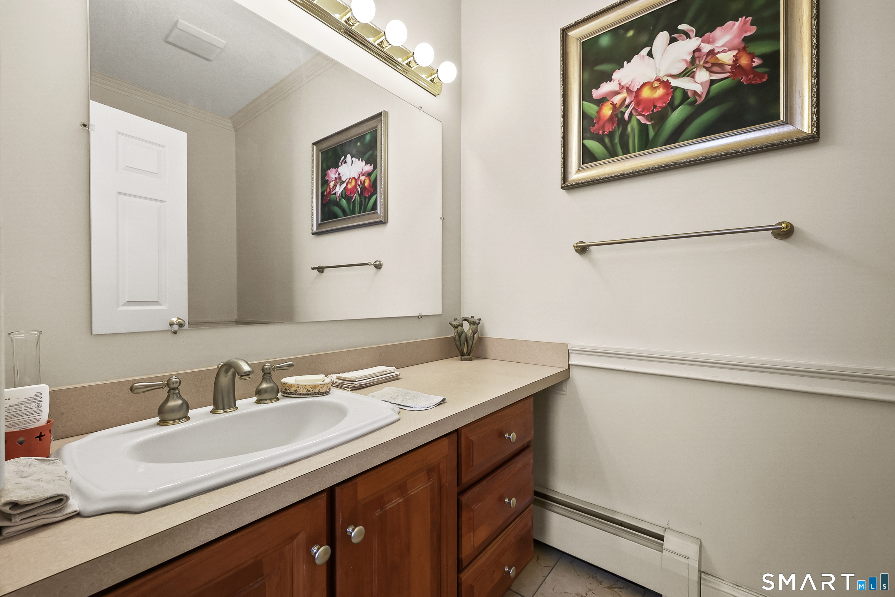 87 Wanda Lane Middletown, CT 06457 - Photo 17 of 39 a bathroom with a sink and a mirror
