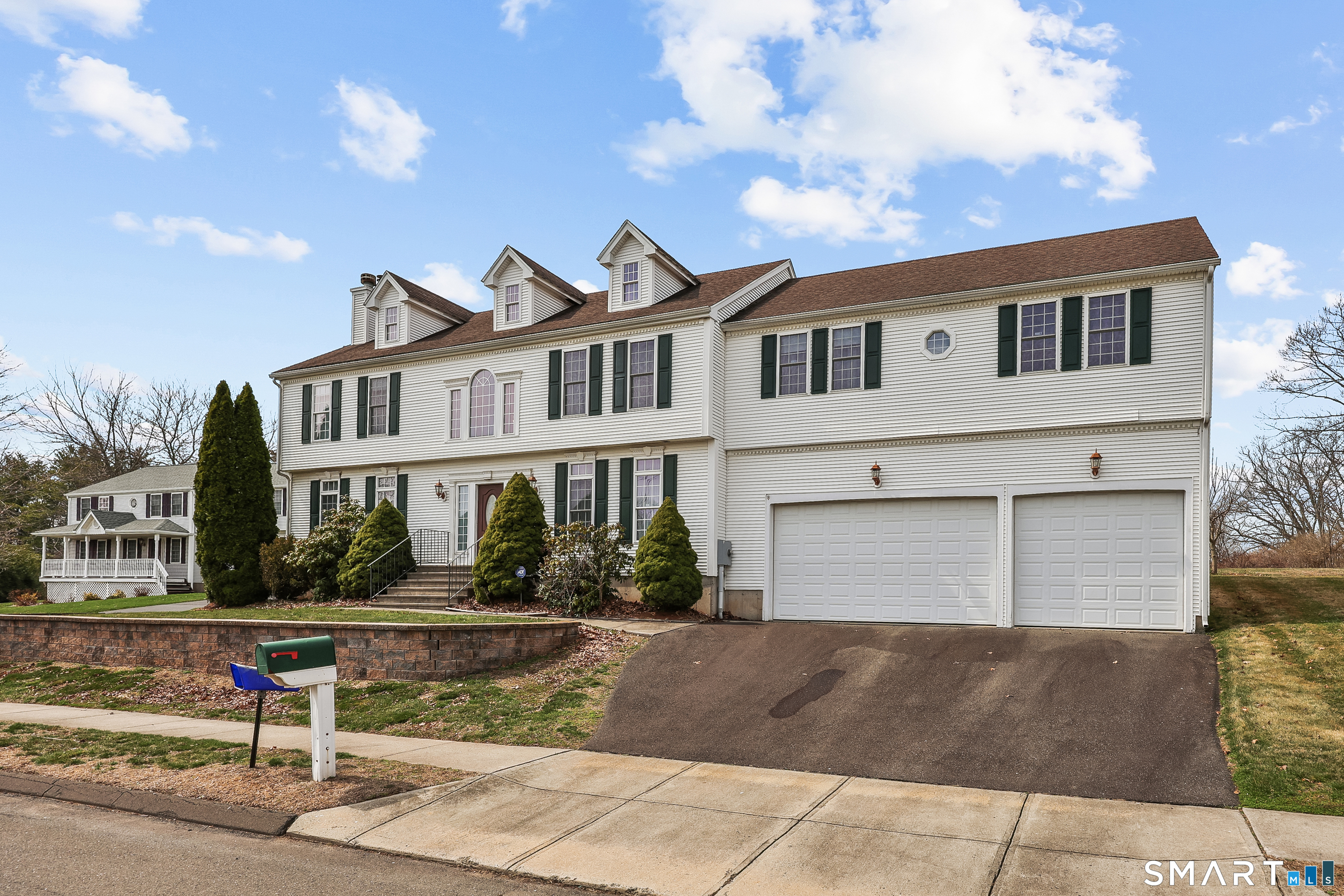 87 Wanda Lane Middletown, CT 06457 - Photo 2 of 39 a front view of a house with a garage