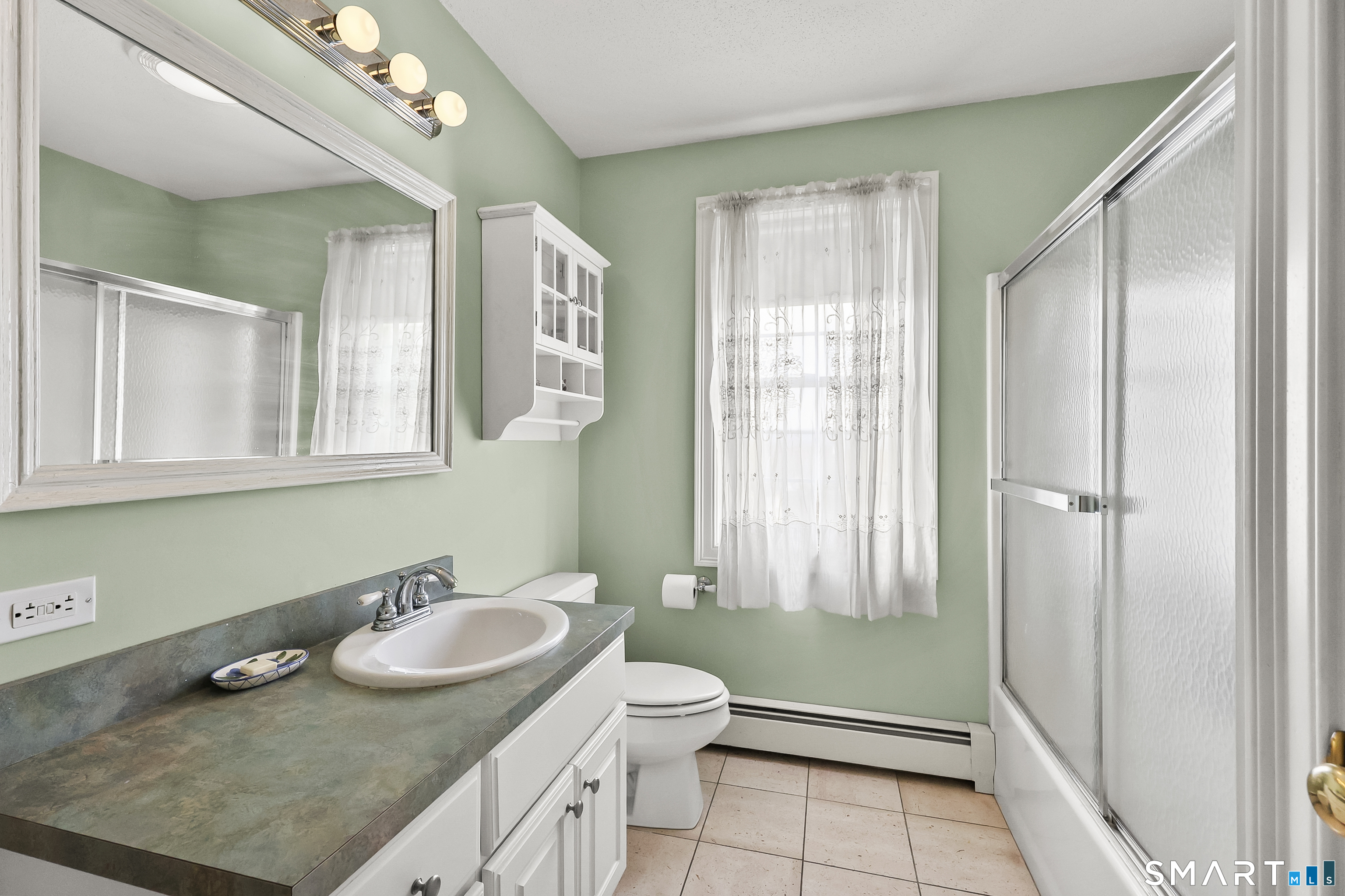 87 Wanda Lane Middletown, CT 06457 - Photo 24 of 39 a bathroom with a granite countertop sink and a mirror