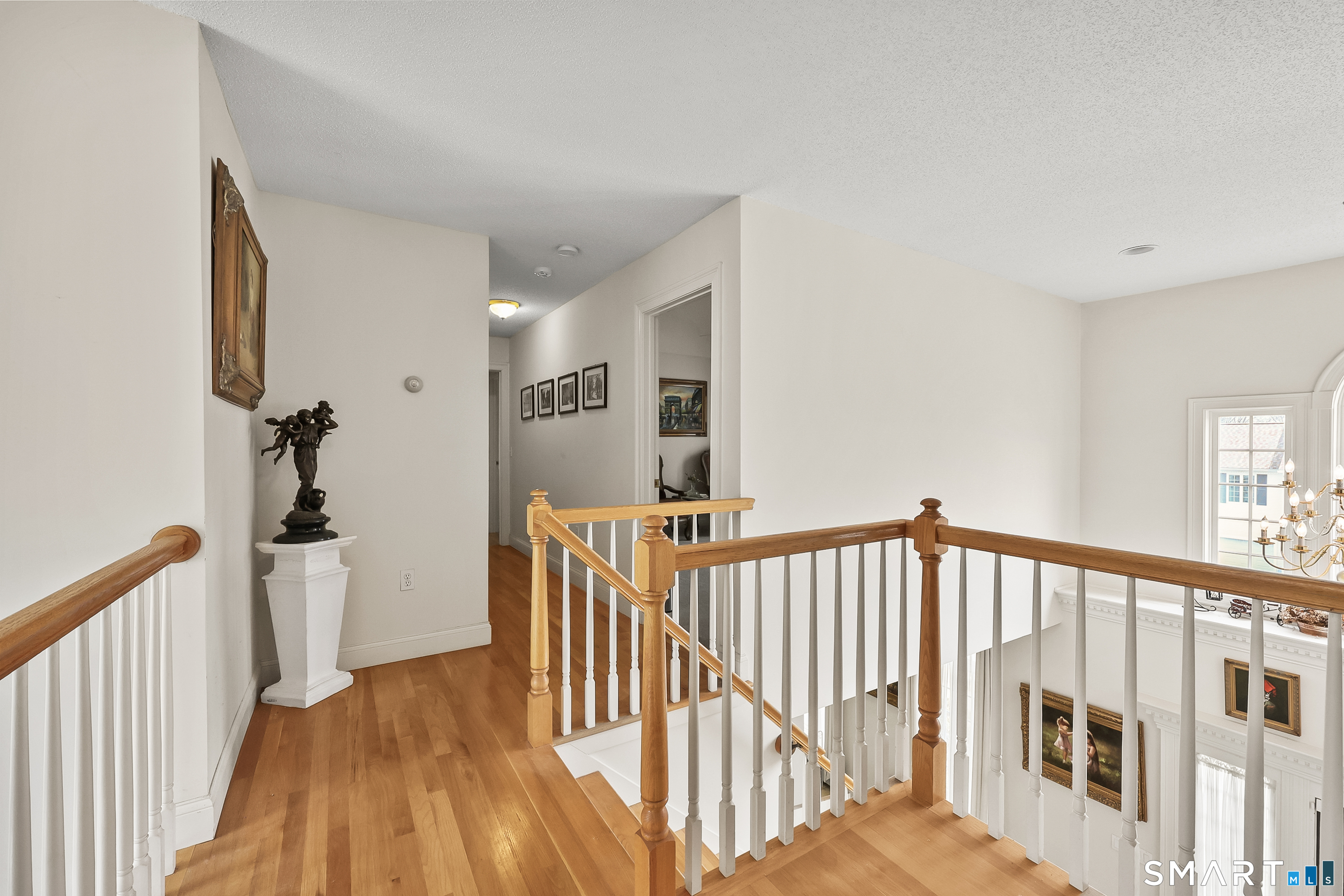 87 Wanda Lane Middletown, CT 06457 - Photo 26 of 39 a view of a hallway with a bedroom