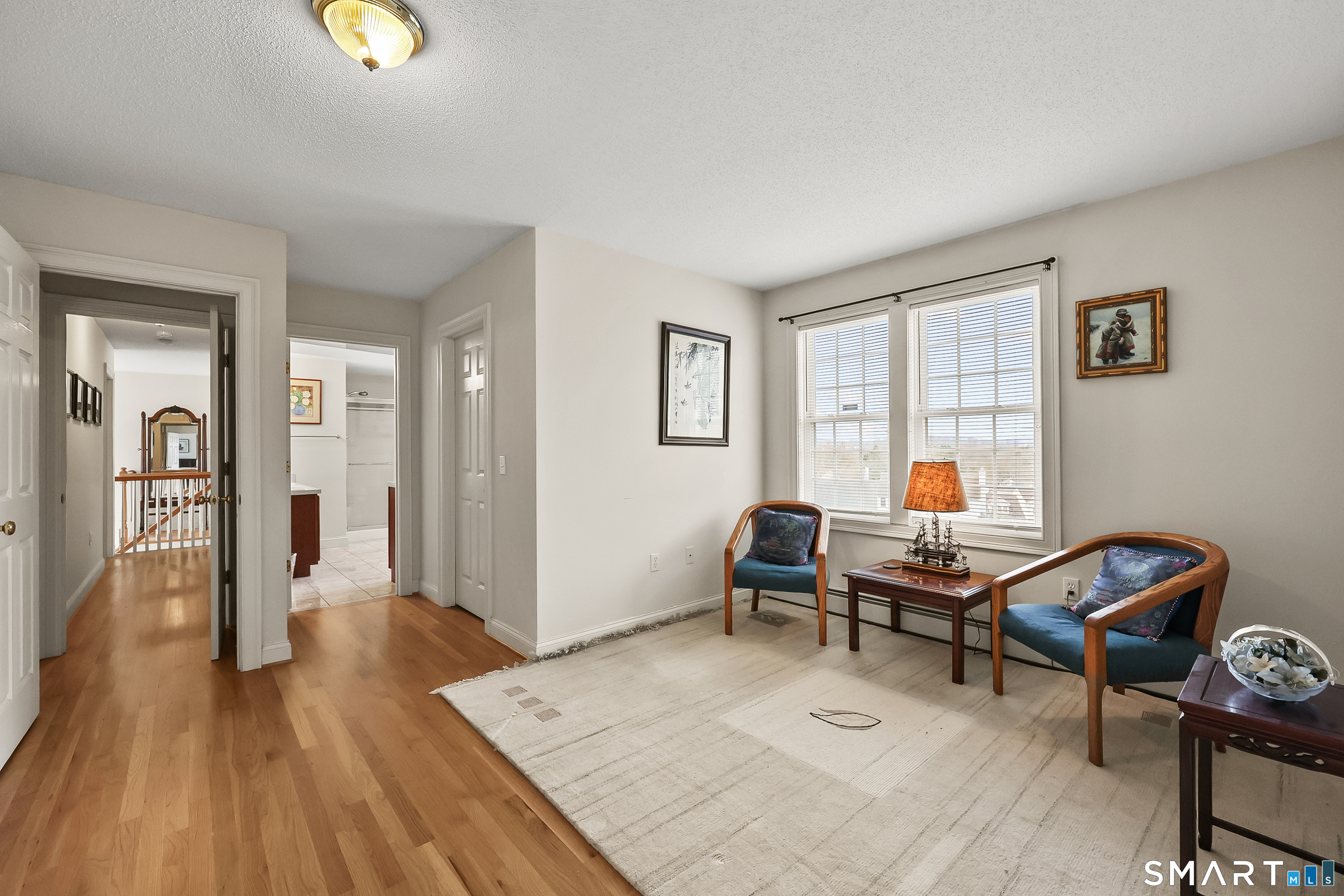 87 Wanda Lane Middletown, CT 06457 - Photo 29 of 39 a living room with furniture and a wooden floor