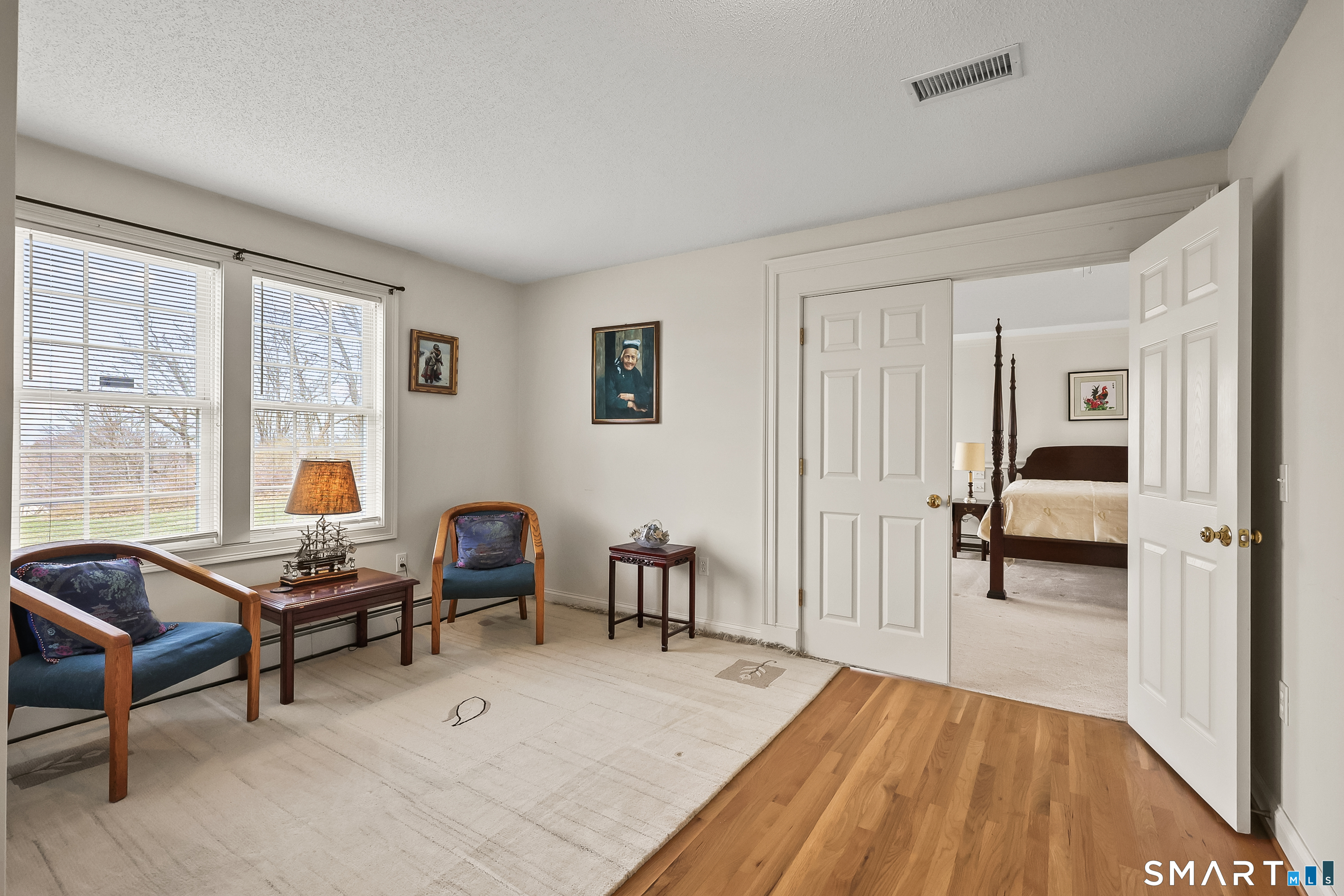 87 Wanda Lane Middletown, CT 06457 - Photo 32 of 39 a living room with furniture and a wooden floor