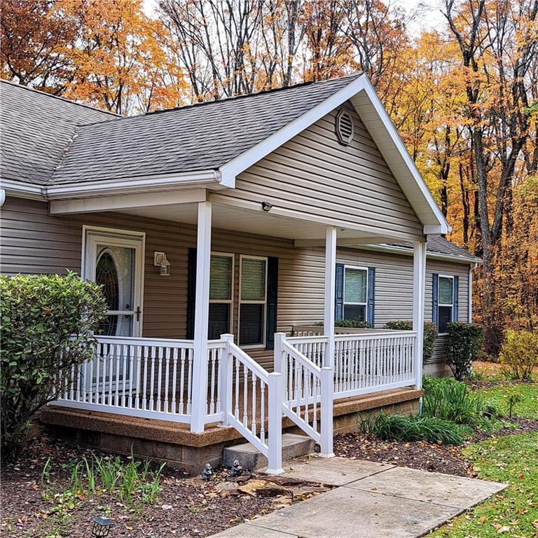 7224 Country Club Road Butler, PA 16001 - Photo 2 of 43 a view of a house with a deck and wooden fence