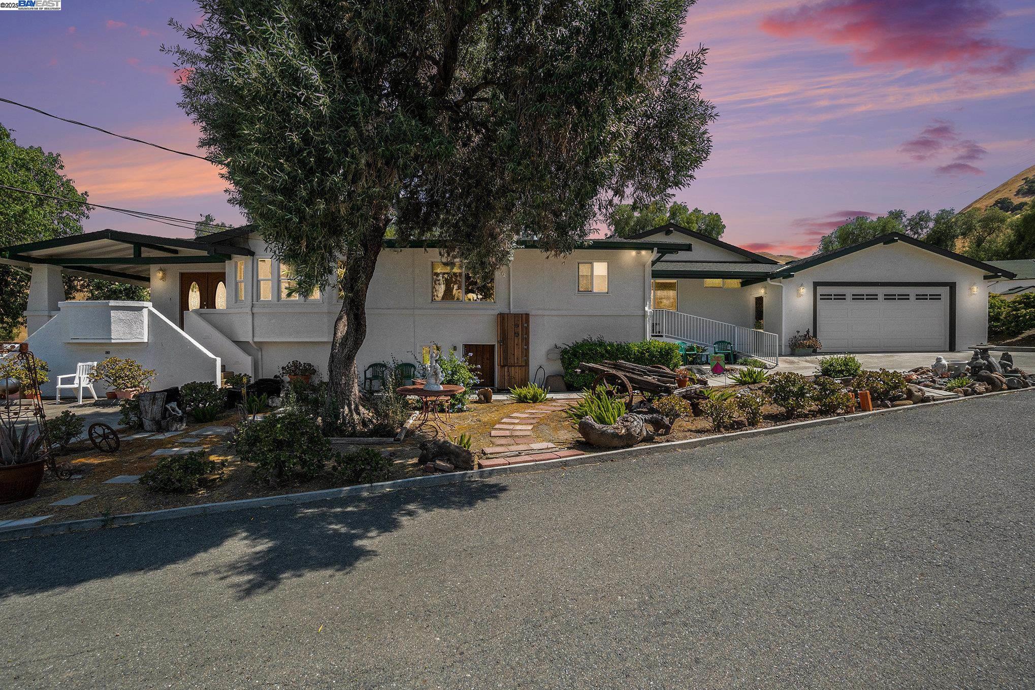 5799 Nortonville Road Pittsburg, CA 94565 - Photo 54 of 59 a front view of a house with yard and trees