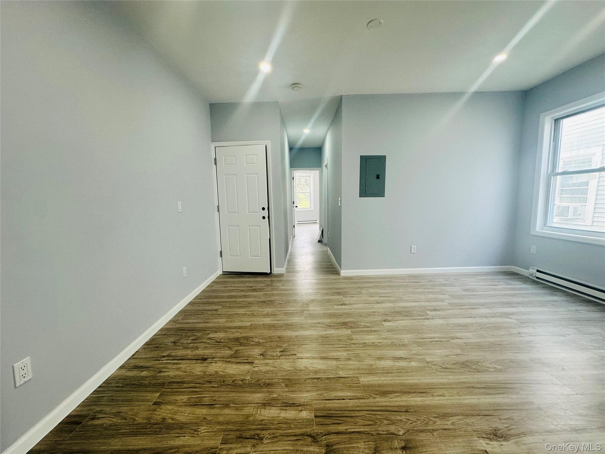 8 Morgan Avenue, Unit 1 Poughkeepsie, NY 12601 - Photo 7 of 11 a view of empty room with wooden floor