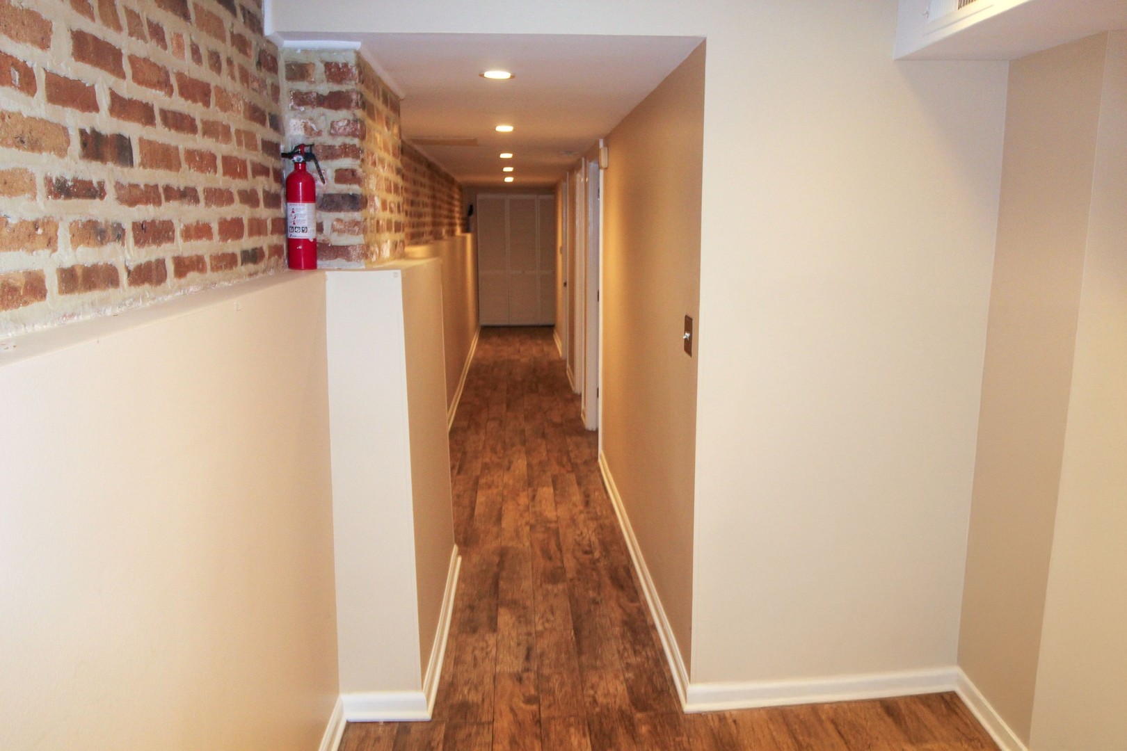 815 South Bell Avenue Chicago, IL 60612 - Photo 14 of 39 a view of a hallway with wooden floor