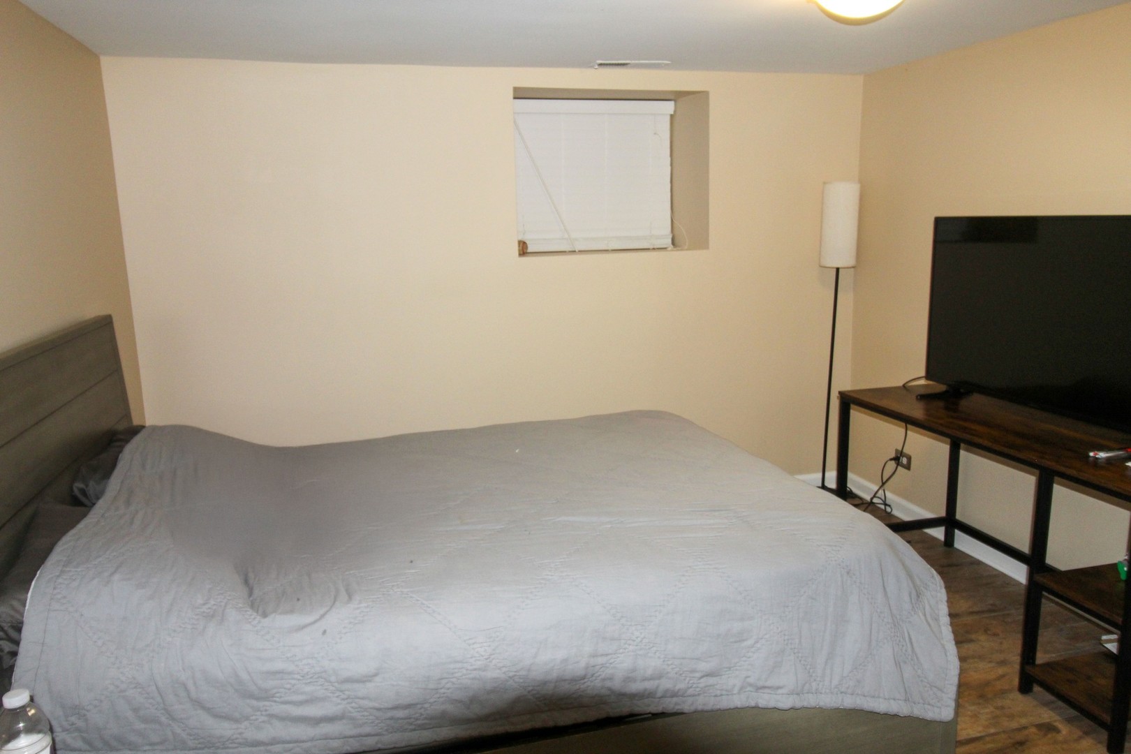 815 South Bell Avenue Chicago, IL 60612 - Photo 15 of 39 a bedroom with a bed and a flat screen tv