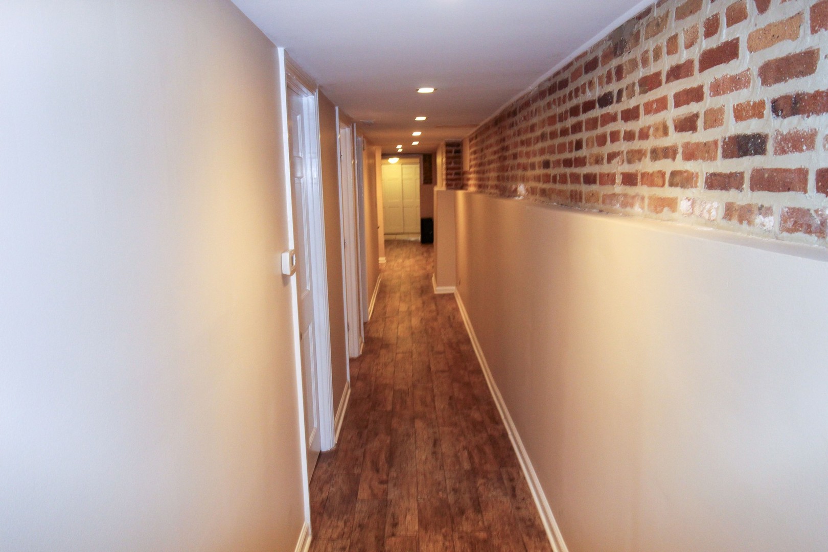 815 South Bell Avenue Chicago, IL 60612 - Photo 18 of 39 a view of a hallway with wooden floor