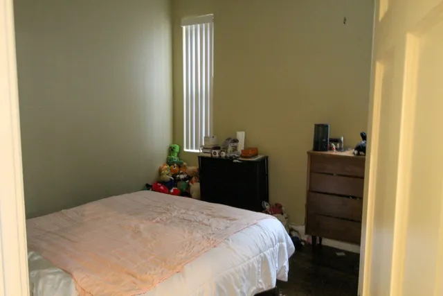 a bedroom with a bed and a closet