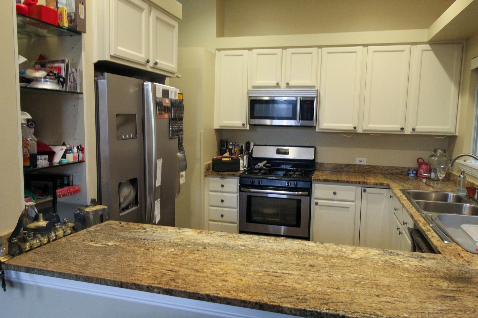 815 South Bell Avenue Chicago, IL 60612 - Photo 28 of 39 a kitchen with stainless steel appliances granite countertop a refrigerator stove and sink