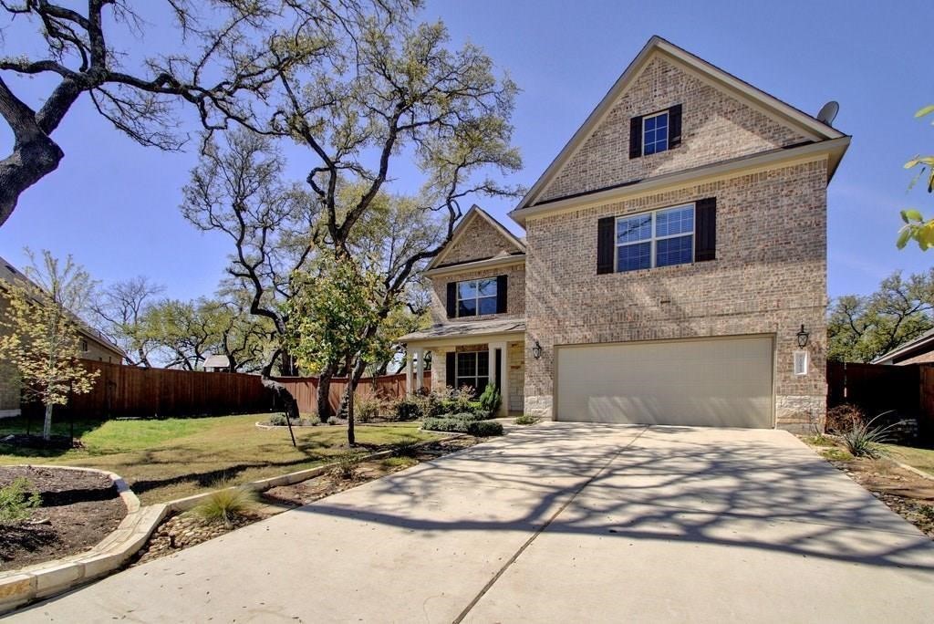 10825 Ballard Path Austin, TX 78717 - Photo 2 of 39 a front view of a house with a yard