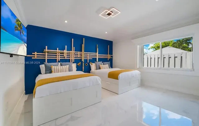 a bedroom with furniture and a chandelier