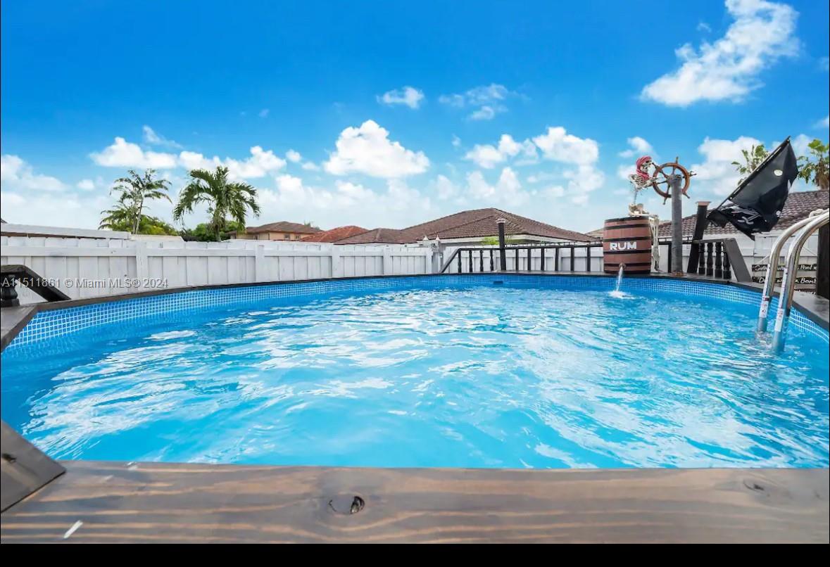 14236 Southwest 164th Terrace Miami, FL 33177 - Photo 24 of 29 a view of a terrace with a garden