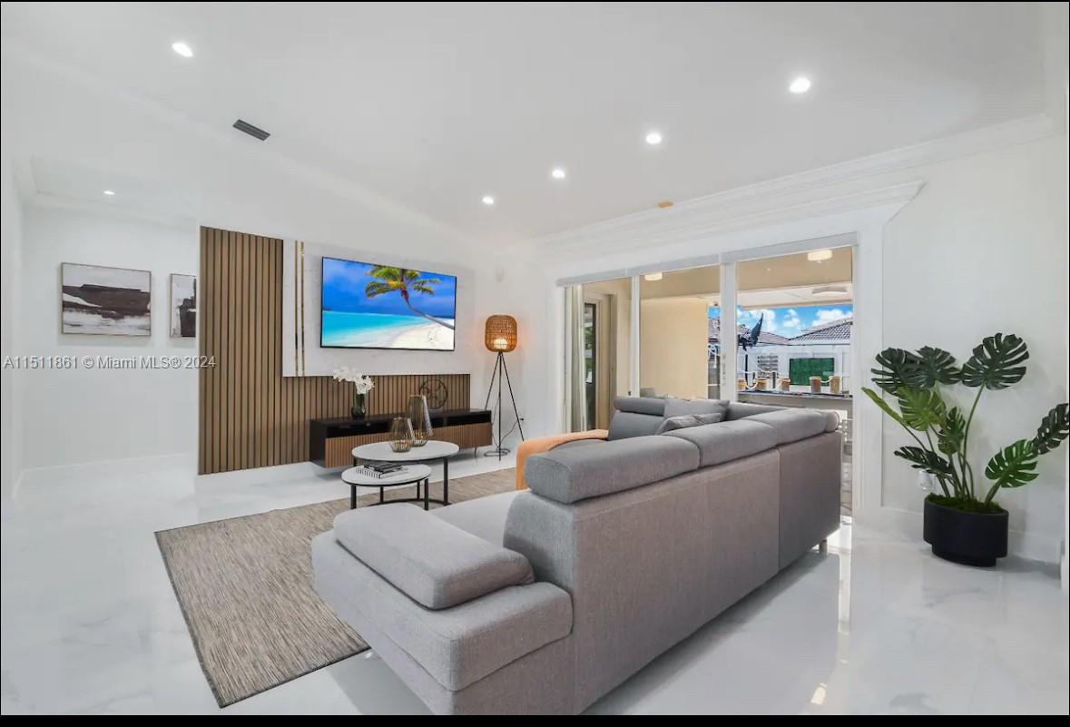 14236 Southwest 164th Terrace Miami, FL 33177 - Photo 3 of 29 a living room with furniture potted plant and a window