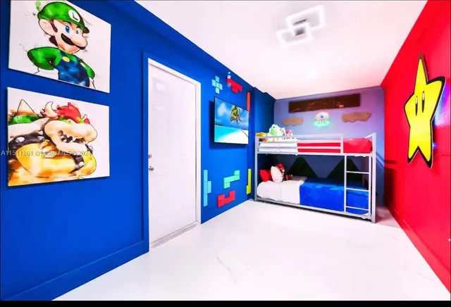 a bedroom with a bed and a dresser