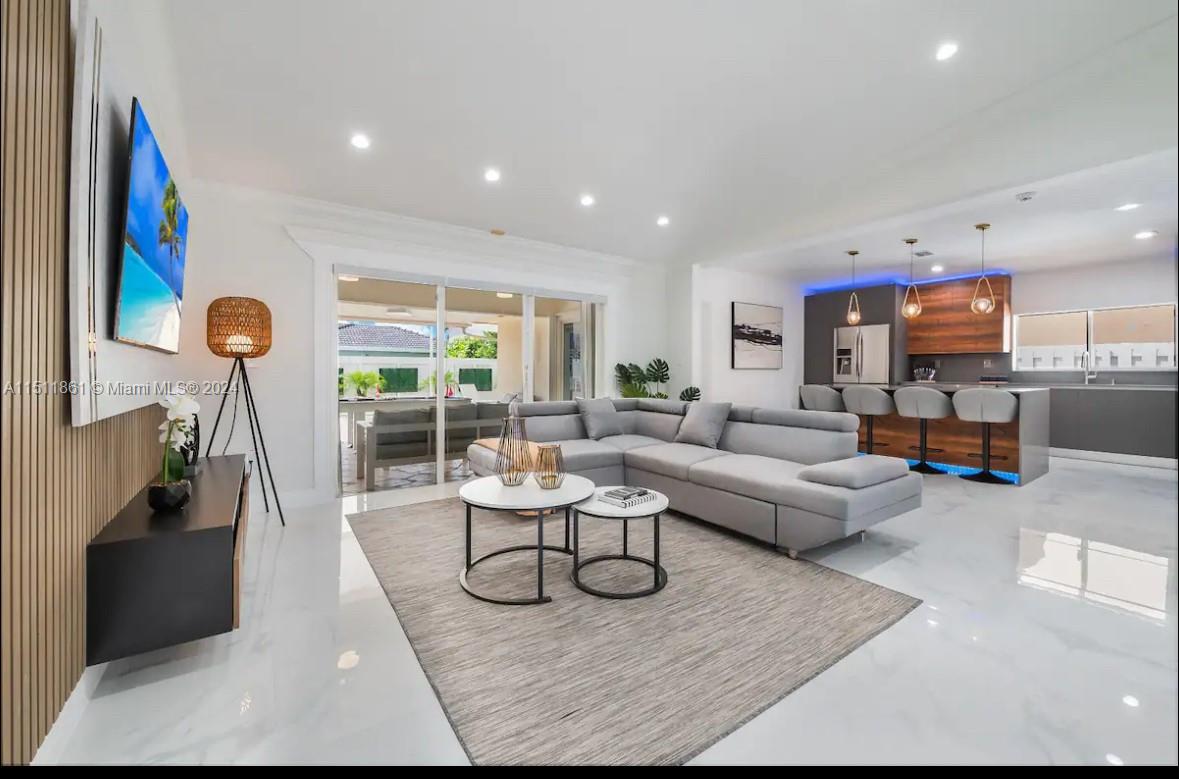 14236 Southwest 164th Terrace Miami, FL 33177 - Photo 8 of 29 a living room with furniture and a large window